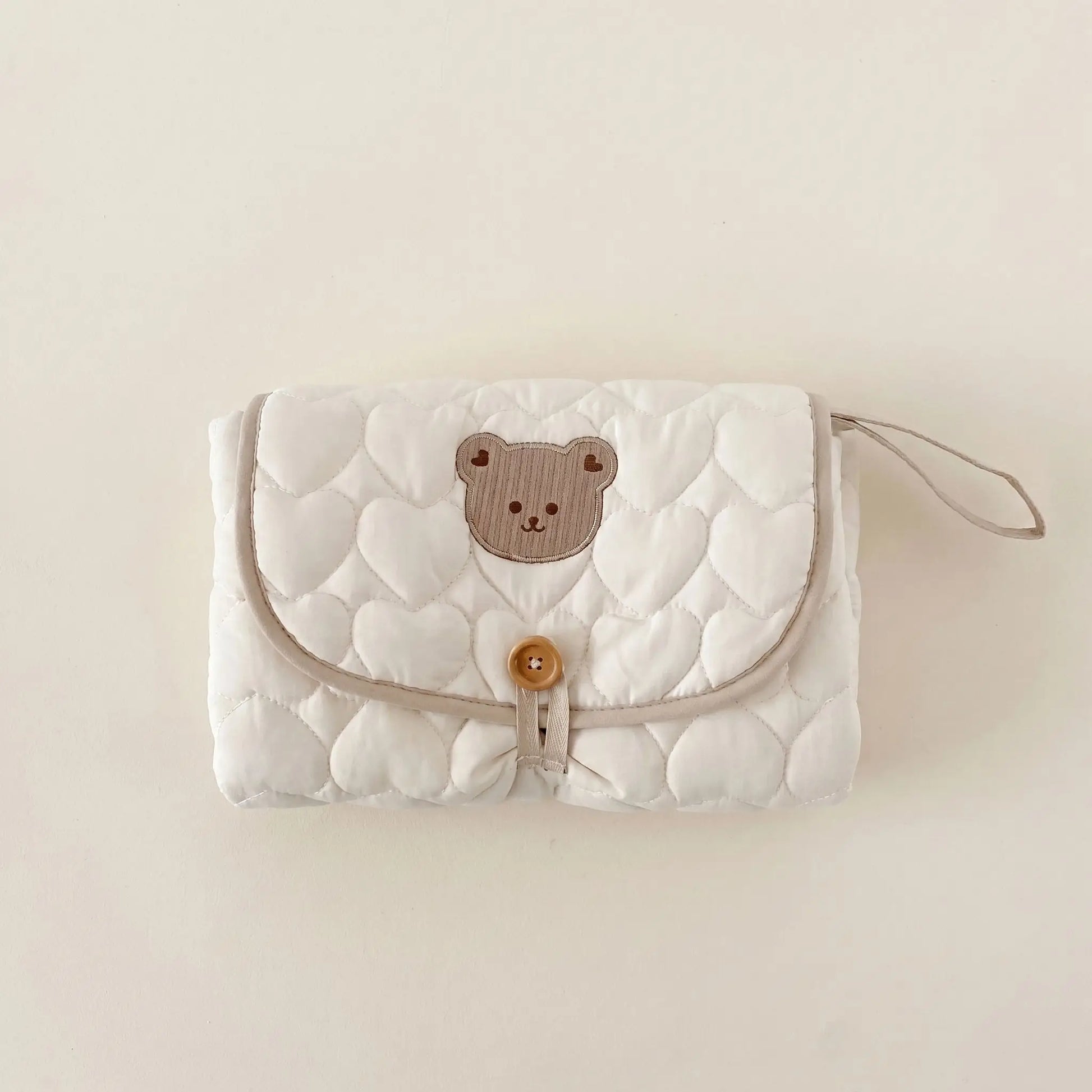 Tapis à langer nomade blanc et brun pour bébé et maman idéal pour les sorties et voyages quotidiens