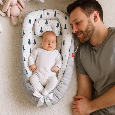 Réducteur de lit bébé avec cocon enveloppant et bordures moelleuses pour sommeil sécurisé du nouveau-né