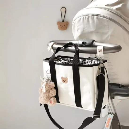 Sac à dos à langer blanc à lignes noires
