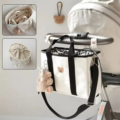 Sac à dos à langer blanc avec  motifs noirs