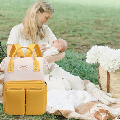 Sac à dos à langer jaune pratique accès facile à tous éléments essentiels