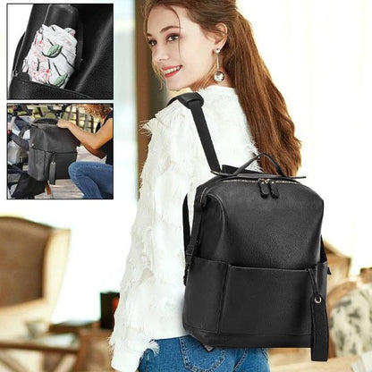 Sac à dos à langer noir en matière synthétique, bretelles ajustables et bandoulière amovible, porté sac à dos ou sac à main