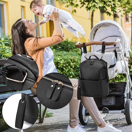 Sac à langer noir avec fixation pour poussette, grande poche frontale zippée, rangements latéraux et espace généreux
