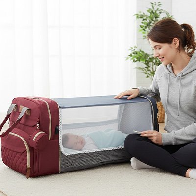 Sac à langer rouge vin 2-en-1 transformable en lit de voyage pour bébé avec matelas intégré