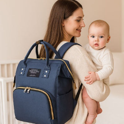 Sac à langer tricolore avec poche frontale zippée pour accès rapide aux essentiels de bébé
